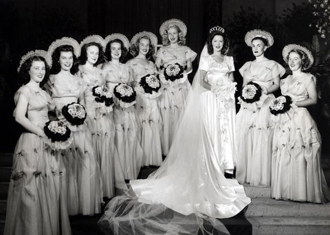 shirley temple wedding with modest wedding dress and bridesmaids gowns with sleeves