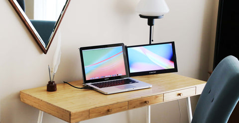 SideTrak portable laptop monitor attached to laptop on a desk