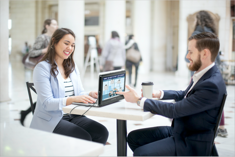 woman and man using the SideTrak Portable Monitor in presentation mode