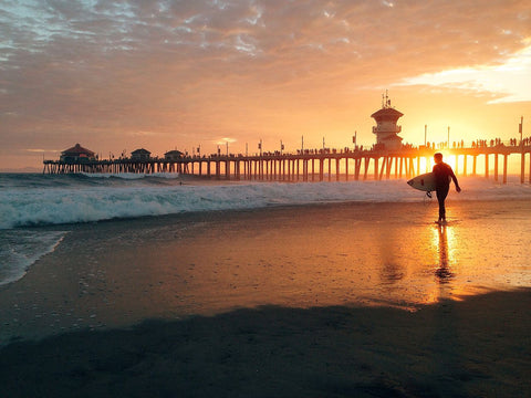 Surfer at Huntington Beach Pier in CA