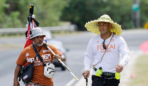 A memorable picture of Frank Camacho and Roman Dela Cruz, where Frank "The Crank" Camacho takes 24-hour runwalk challenge for Guam's homeless with Roman Dela Cruz and others.