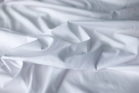 White Sheets messy on a bed southshore Fine linens