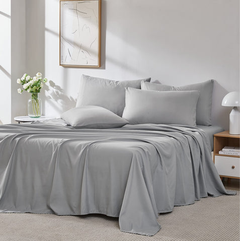 A made bed with gray 600 thread count sheets from Southshore Fine Linens.