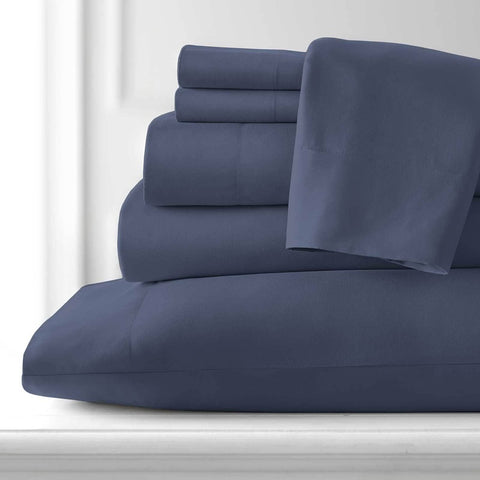 A stack of Vilano extra deep pocket 6-piece sheet set in dark blue from Southshore Fine Linens.