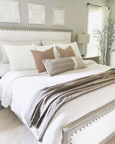 vilano white quilt in a bedroom that is farmhouse style
