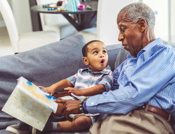 grandfather reads to grandson
