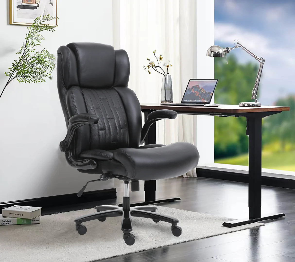 Black office chair in a home office setting with a desk and laptop.