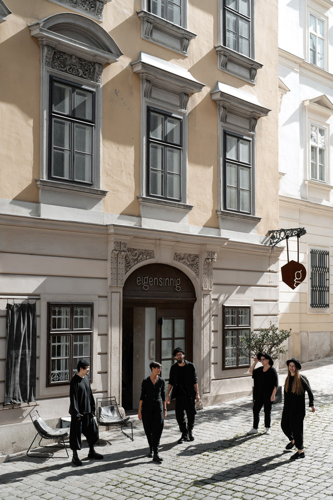 The team of eigensinnig wien in front of the extravagant fashion shop in Vienna