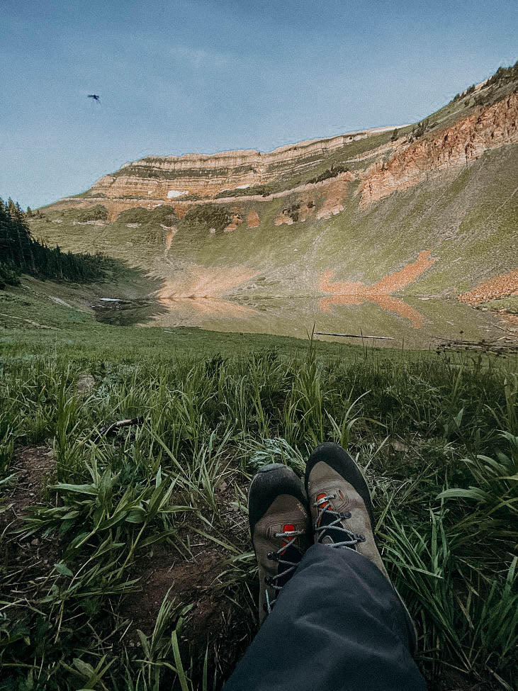 Resting by high mountain lake in crispi Lapponia GTX boots