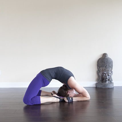 Isolated studio shot of a fit Caucasian woman holding the kapotasana Pigeon Pose  yoga position on an exercise mat Stock Photo - Alamy