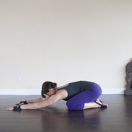 Caucasian woman practices yoga asana balasana or child pose Stock Photo -  Alamy