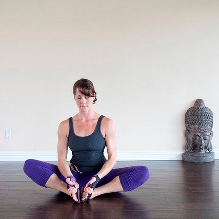 Rear view of young female yogi in sports bra and leggings doing bound  extended side angle pose, baddha utthita parsvakonasana, while practicing  yoga indoors Stock Photo | Adobe Stock