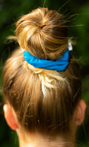ballerina bun with blue scrunchie