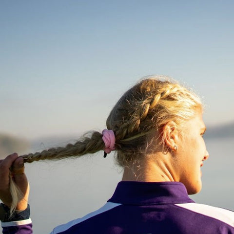 woman wearing pink scrunchie