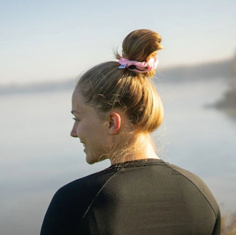 woman with pink scrunchie