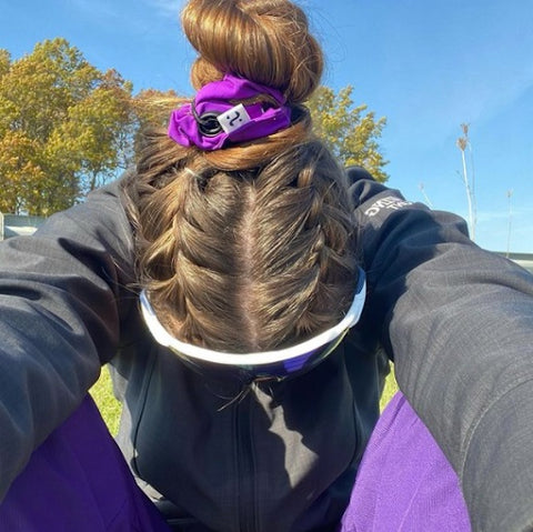 woman wearing purple scrunchie