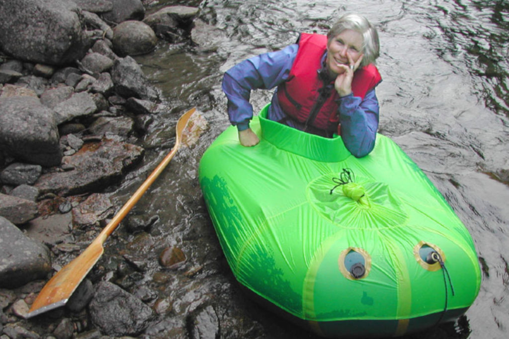 Sheri Tingey, Co Founder of Alpacka Raft, testing one of the very first spraydecks for a packraft that she designed