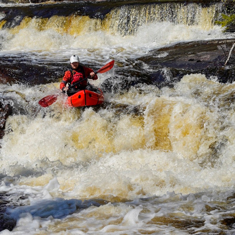 Alpacka packraftin in whitewater during the Nordic Roundup