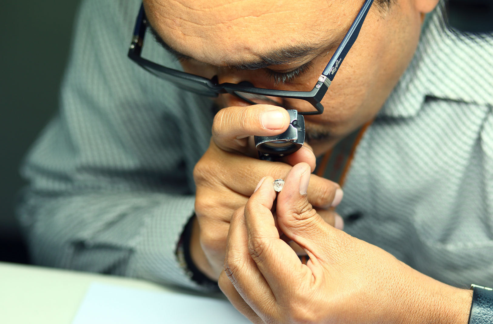 Man assessing a diamond