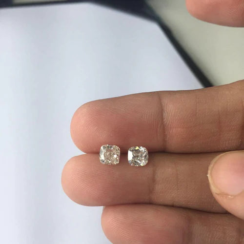 Old european old mine cut diamond next to a brilliant cut diamonds