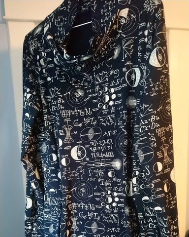 Sweater dress in navy jersey with white physics equations written on it.