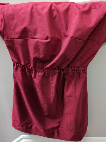 A loose red dress with bust darts, wide short sleeves, and an elastic waist