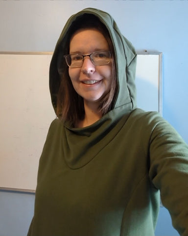 Jenn in a green hooded sweater
