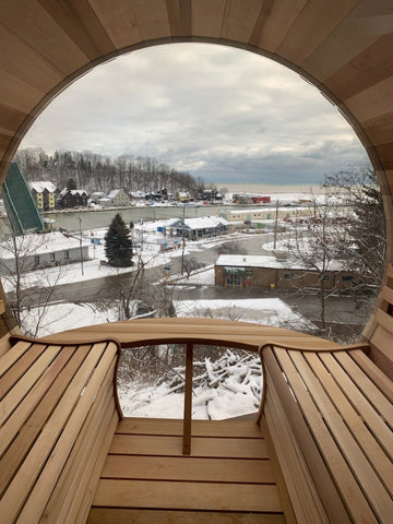 interior view of barrel sauna overlooking river canada.