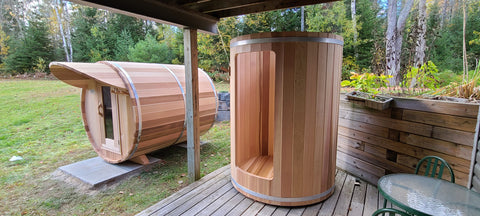 barrel sauna and barrel shower outdoors backyard.