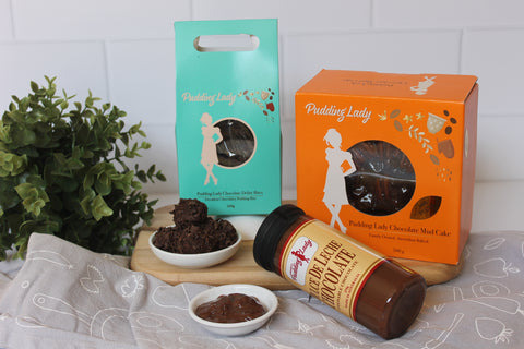 Choc and Pecan cake, choc delite bites and choc sauce all shown in beautiful packaging from the Pudding Lady