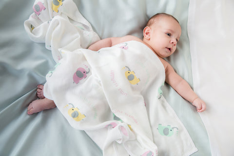 Bamboo Muslin Swaddle with a baby