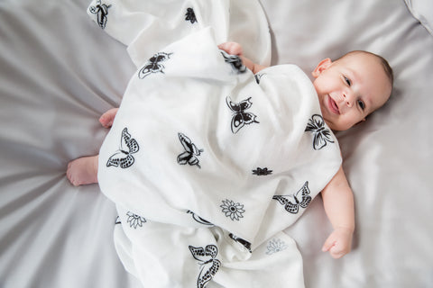 muslin swaddle with a baby