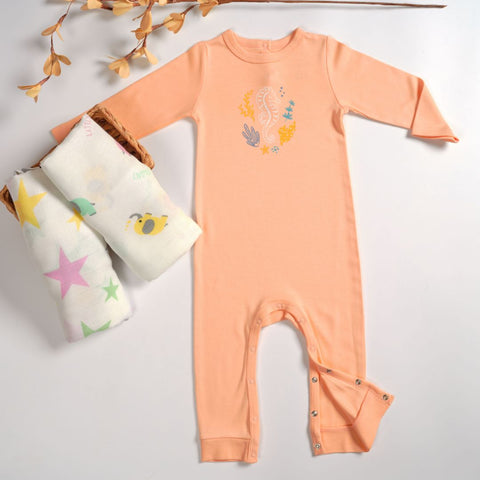 organic sleepsuit with a muslin swaddle