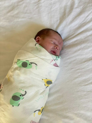 swaddling baby with muslin swaddle