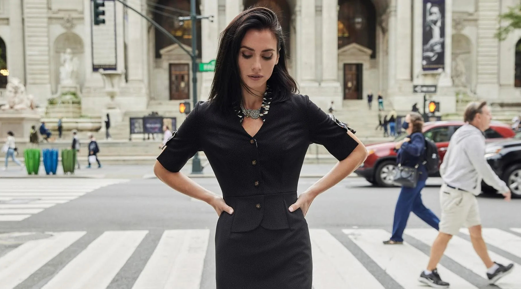 A model wearing the Stephanie Dress on a New York City street