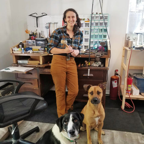 Katie Johnston in her studio with her two dogs