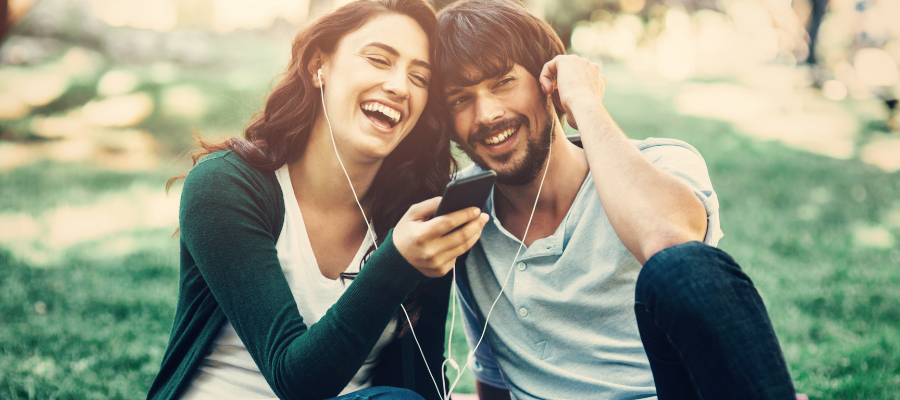 happy couple listening to music together