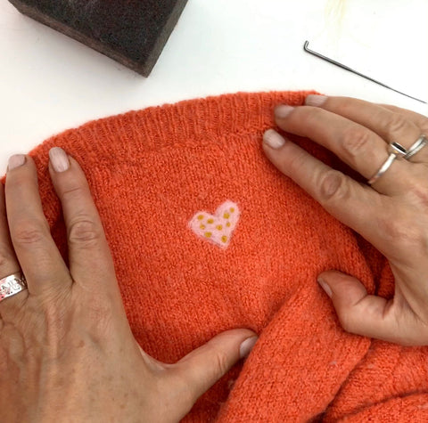 Upcycle knitwear using needle felting