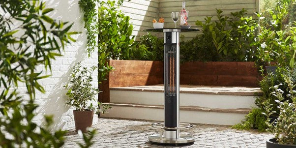 Image of a patio heater in a modern looking garden on a slabbed patio