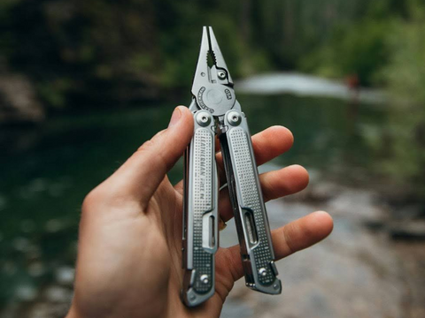 Using a Leatherman multi-tool on one’s outdoor adventure trip.