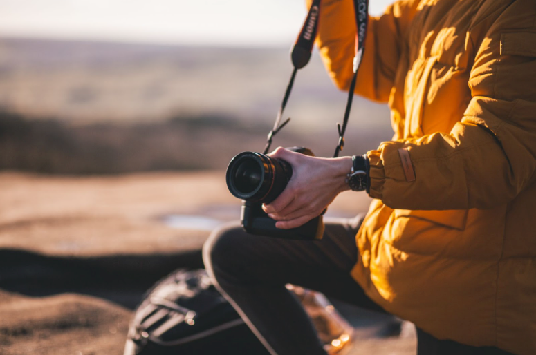 You need to take precautions to prevent a camera from falling or swinging too wildly while you’re on an outdoor photography trek.