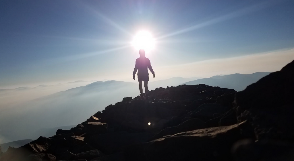 Man on a Colorado mountain. Colorado is the US state with the most 14er peaks.