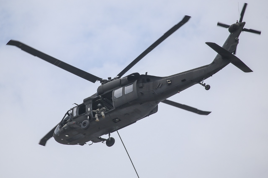 Blackhawk helicopter prepared for a fast-roping maneuver. Fast-roping was briefly featured in the filmBlackhawk Down.