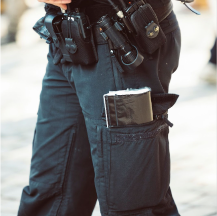A closer look at a law enforcer’s tactical pants. Multiple pockets allow for better storage functionality combined with quick deploymen