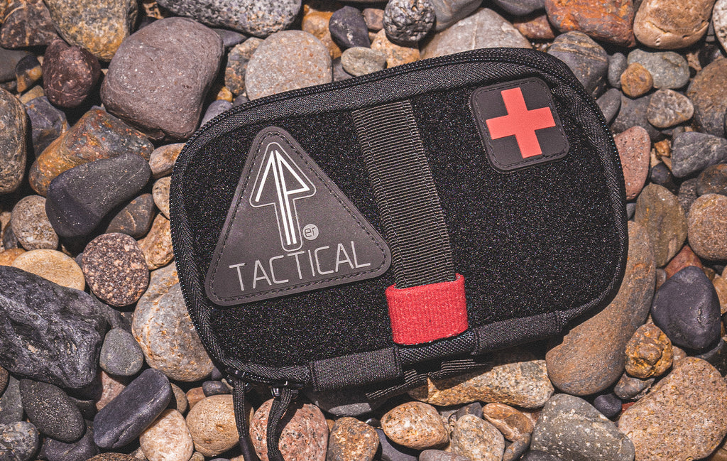 An IFAK pouch carries essential trauma gear