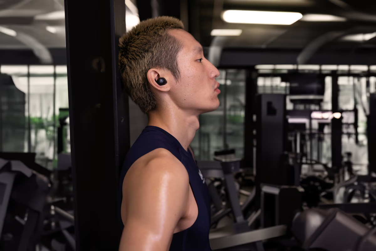 Sennheiser MOMENTUM Sport True Wireless Earbuds with Adaptive Noise Cancellation On Model