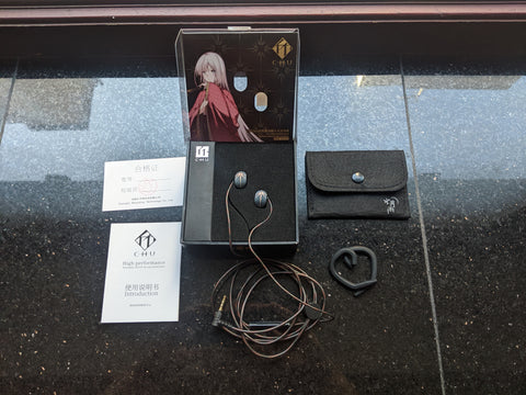 Moondrop Chu IEMs, headphone cable, warranty card, instruction manual, packaging