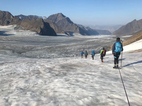 group walking on the glacier