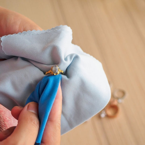 Cleaning gold jewelry with a soft cloth