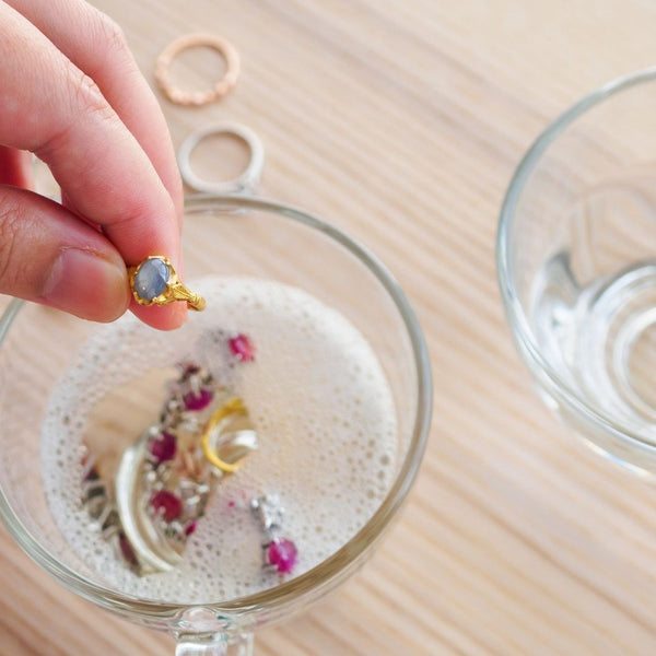 Clean jewelry in warm soapy water